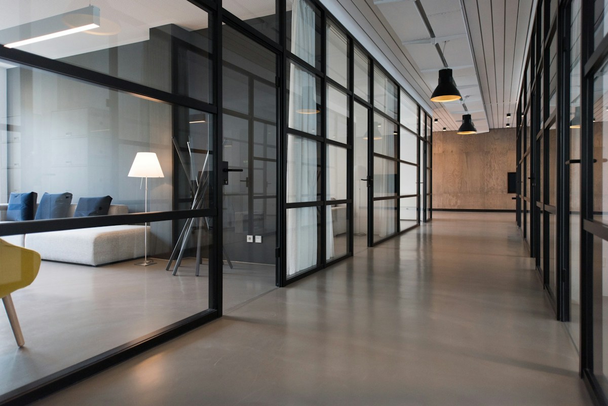 Modern office with open workspaces and large windows